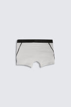 light grey boxer briefs with black waistband on a light gray background