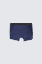 Blue boxer briefs with black waistband on a light gray background