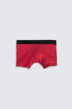 Red boxer briefs with black waistband on a light gray background