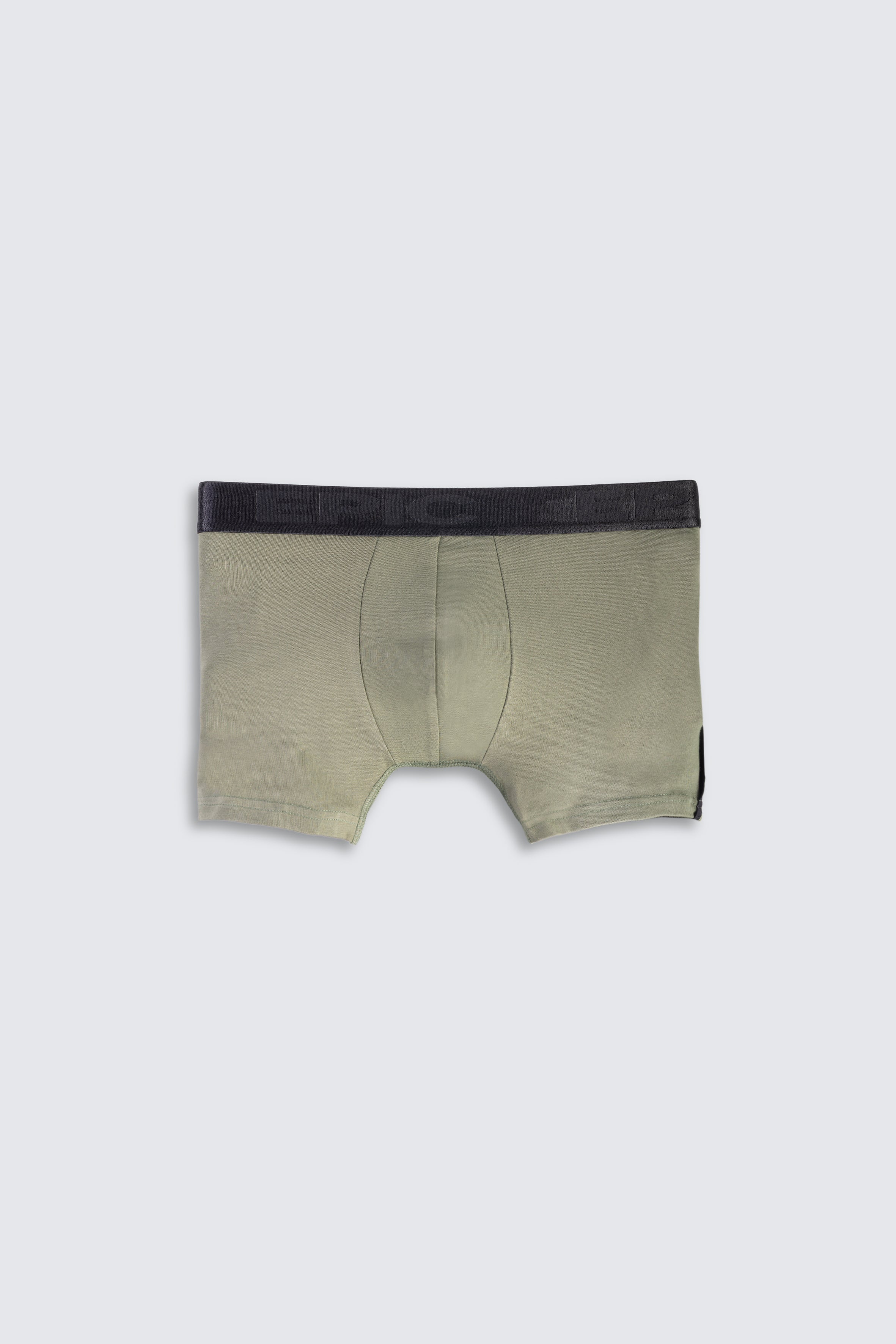 Green boxer briefs with black waistband on a white background